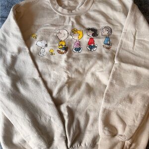 Urban Outfitters Peanuts Graphic Sweatshirt in Cream